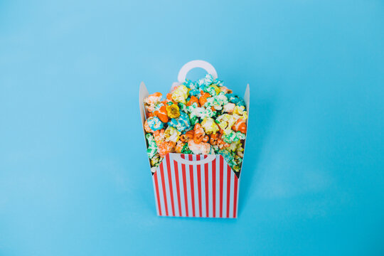 colorful candy pop corn on a blue background