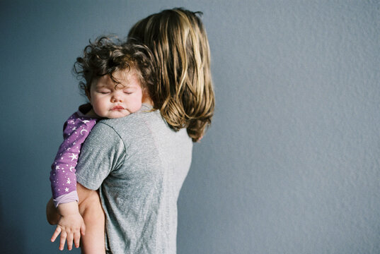 Holding a sleeping baby