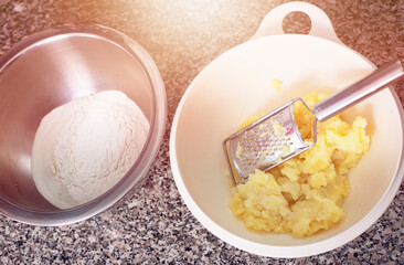 Mashed potatoes and flour in bowl.Dough base for pierogi dish.