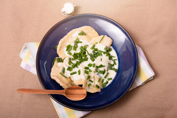 Pierogi with sheep cheese on blue plate.High quality photo.