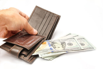 Dollars money in your wallet and hands on a white background