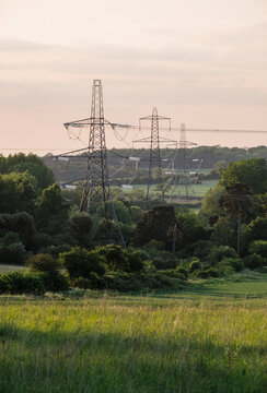 Electricity pylon in a rural location at sunset. Norfolk, UK.