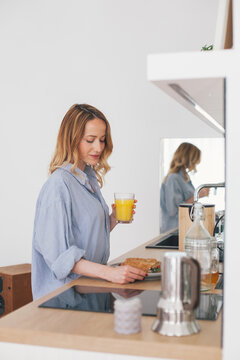 Woman preparing breakfast in a modern kitchen