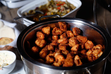 dore chicken cut into cubes and served in pan