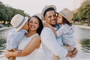 Portrait of a beautiful African American family enjoying the day in the park.