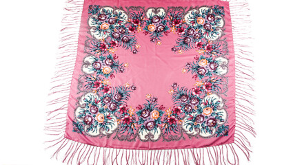 top view flat lay on pink cotton scarf with fringe and bright floral ornament