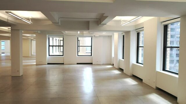 Slider Shot Right of an Empty White Office Space with Windows