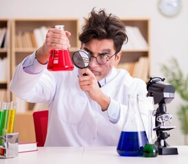 Mad crazy scientist doctor doing experiments in a laboratory