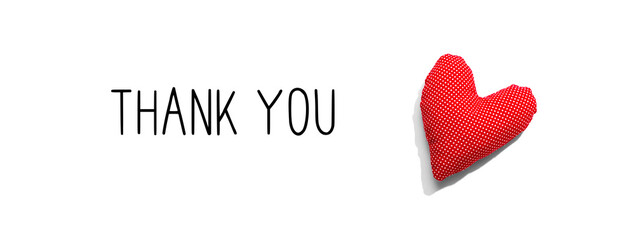 Thank you message with a red heart cushion - flat lay