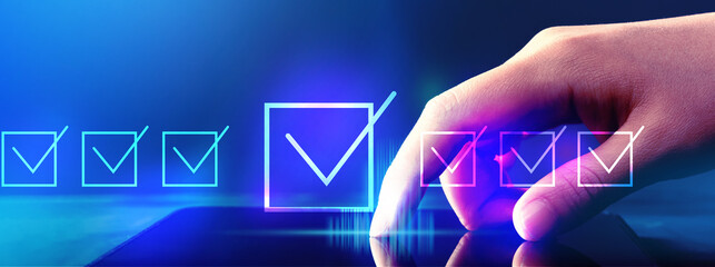 Checklist concept with hand pressing tablet computer screen
