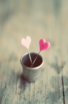 Hearts and a thimble
