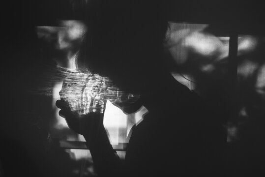 Silhouette woman with glass of wine