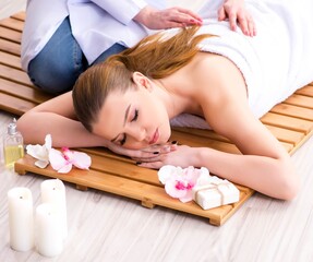 Fototapeta na wymiar Young woman during spa procedure in salon