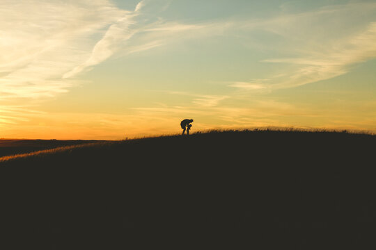 Father and child in large field.