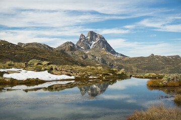 Ibon de Anayet and the Portalet with the bottom the Anayet peak. Concept famous mountains of the...