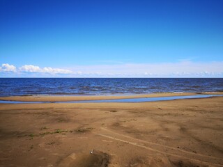 the sandy shore of Lake Ilmen waves the wind of the sky