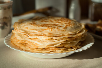 homemade pancakes. in the photo, pancakes cooked at home, illuminated by sunlight in the kitchen, close-up