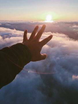 Hand Over The Sky At Sunset.