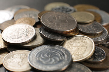 Many coins on a black background