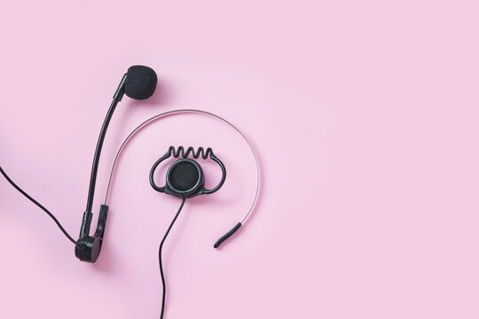 Translation center. Set for telemarketing. Manager customer. Listening operator. Flatlay. Person multi language translator. Pink color background. Multy guide. Speakers device. Conference equipment