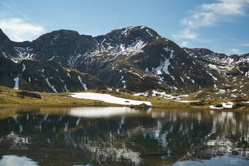 Ibon de Anayet and the Portalet with the bottom the Anayet peak. Concept famous mountains of the...