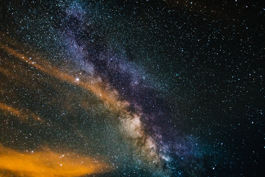 Photograph of the Milky Way in summer, with a sky full of stars and curious details