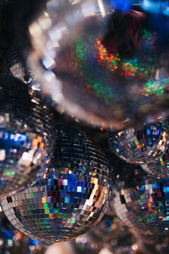Group of disco balls hanging from the ceiling