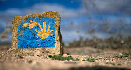 milestone representing the sign of the Way of St. James with an