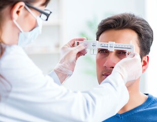 Ophthalmologist is checking up patient in eye doctor hospital