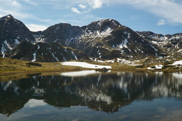 Ibon de Anayet and the Portalet with the bottom the Anayet peak. Concept famous mountains of the...
