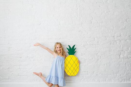 Preschooler Girl Posing With Paper Pineapple