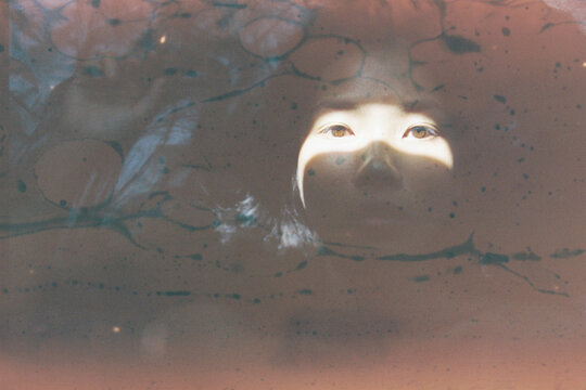 Portrait of woman with shadow play on face