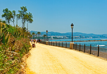 View of the Maritime Promenade of Marbella which is considered one of the most beautiful pedestrian areas along the coast © sphraner