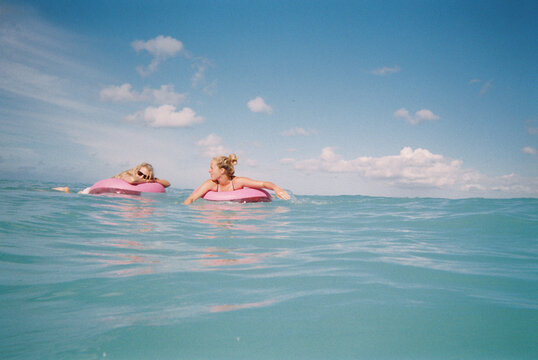 swimming with floaty in blue ocean in hawaii