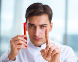 Man doctor checking blood samples in lab