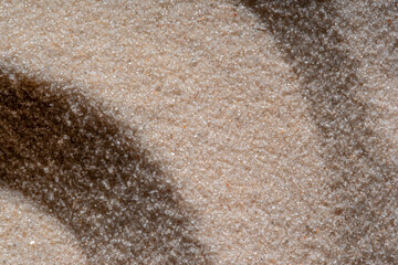 close up texture of sand beach from top view for wallpaper background