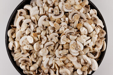 sliced fresh mushrooms in a pot