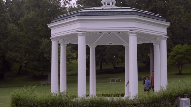 Parents And Two Children Walk To Morgan Park Gazebo In Glen Cove Long Island