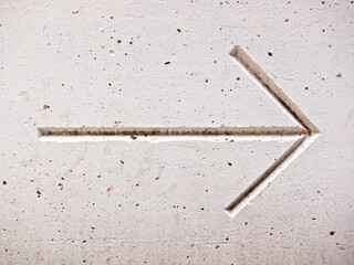 Directional arrow in concrete
