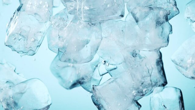 Super slow motion of rotating ice cubes in the  water. Filmed on high speed cinema camera, 1000 fps.