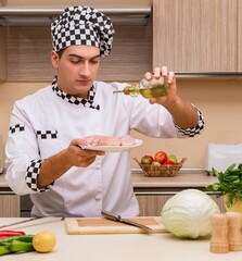 Young chef working in the kitchen
