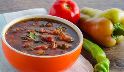 Bowl of traditional soup Borscht on table