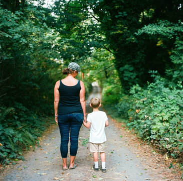 Mother and son stand in country lane