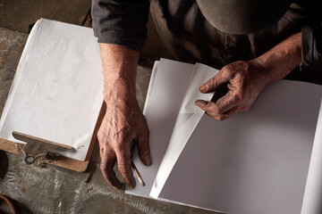 Metal worker and book