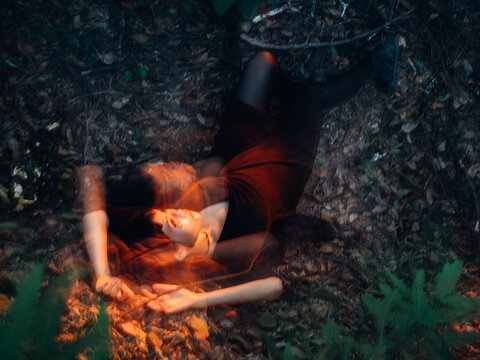Asian woman with halloween makeup in forest