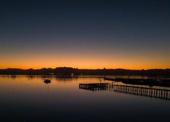 Boat and wharf at sunset on Bodega Bay, northern California