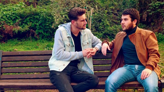 feel excluded - young man is excluded from the conversation by two friends