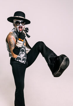 Bizarre fashion studio portrait with extreme makeup