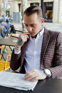 Man in a bar reading