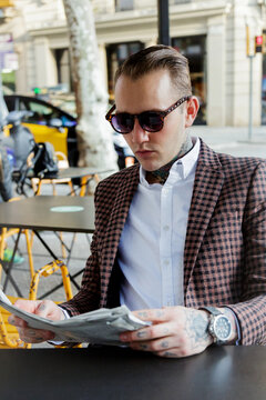 Man in a bar reading